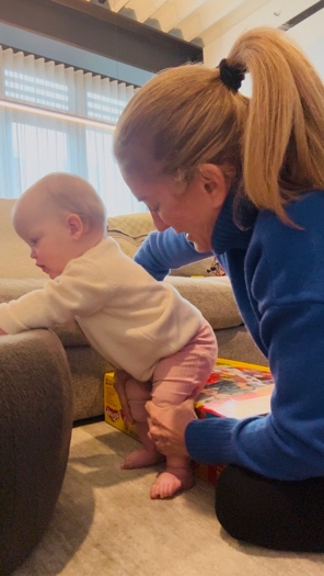 A baby practising an early motor skill during a developmental evaluation.